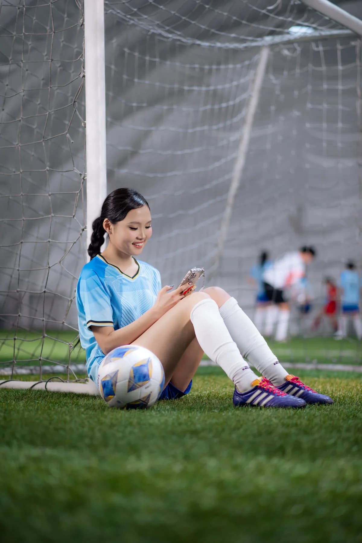 Player checking a phone after the match